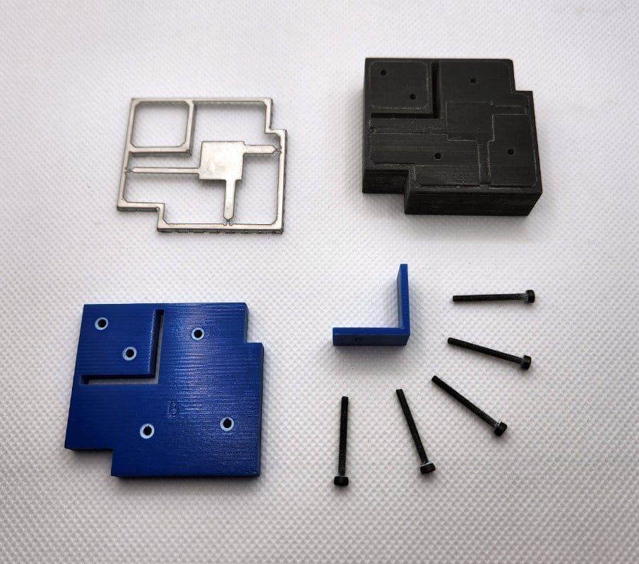 Exploded view of press mold for shield can frame