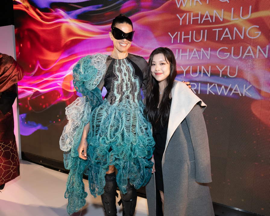 Kiki Zuo and her model posing with the 3D printed design on the runway at the Otis Fashion Show