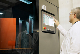 a-man-operating-neo-3d-printer