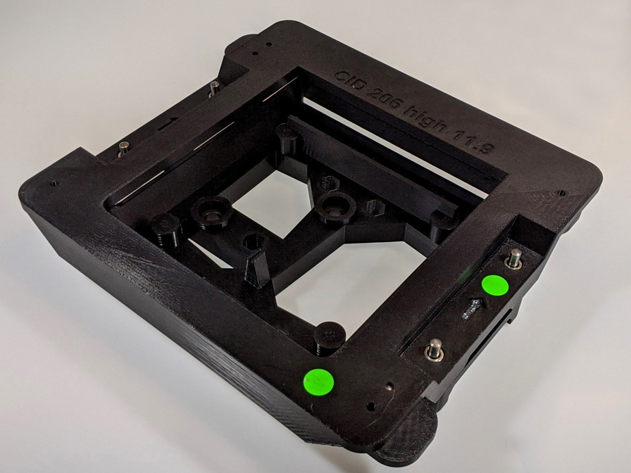 This ESD-compliant auto display gluing jig printed with ABS-ESD7 material ensures safe handling around electronics.