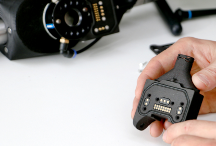 Rivelin Robotics header image hands holding plug