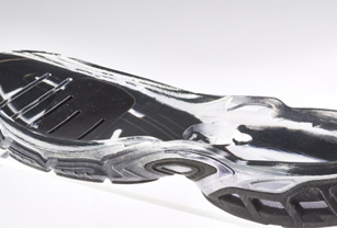 The opaque flexible material has been over-molded into the transparent rigid material. This was achieved via a single print.