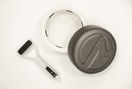 A grasping pincer (left) and packaging lid (right) –   3D printed with Stratasys PolyJet technology. Multimaterial 3D printing was used to create the white structural components and black rubber-like grips all in a single print.