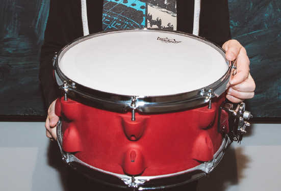 dan pawlovich holds red 3d printed snare drum