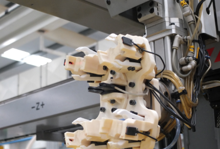 3D printed handling tool for robotic arms enables complex geometries not achievable with CNC.