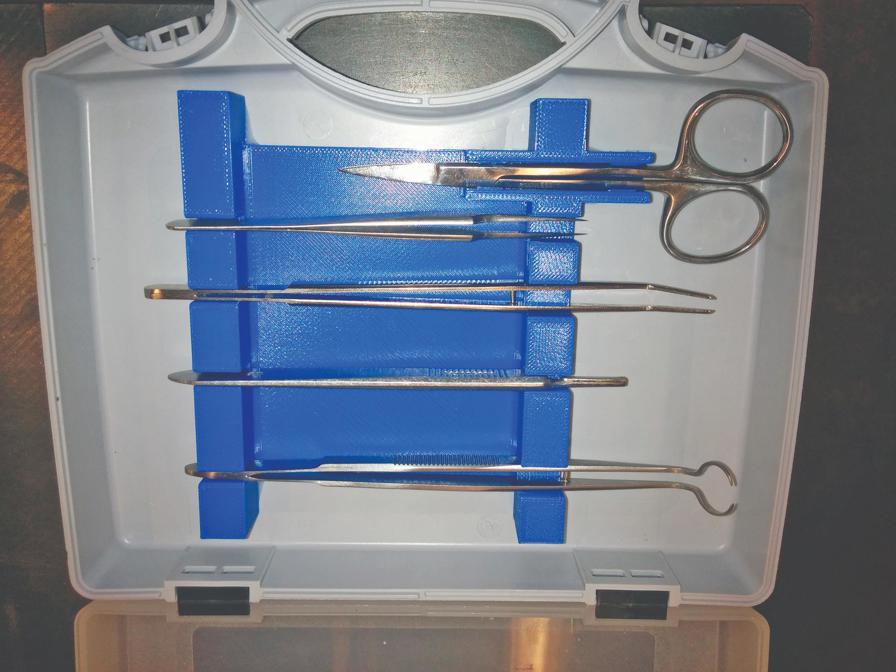 This blue 3D printed tray was custom-created to accommodate the
size and shape of these surgical tools.