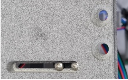 track for adjustment screws