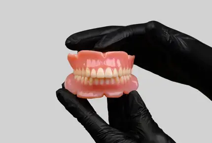 black-gloved-hands-holding-truedent