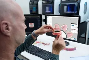 lab-tech-at-grabcad-screen-inspecting-truedent-denture