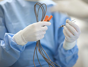 doctor-holding-surgical-equipment