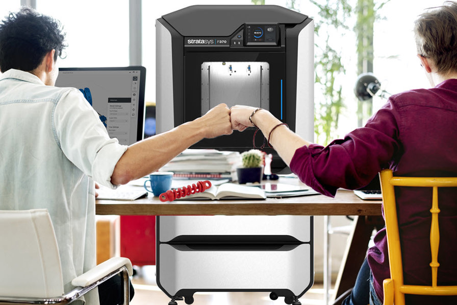 Employees working on a design with Stratasys F370