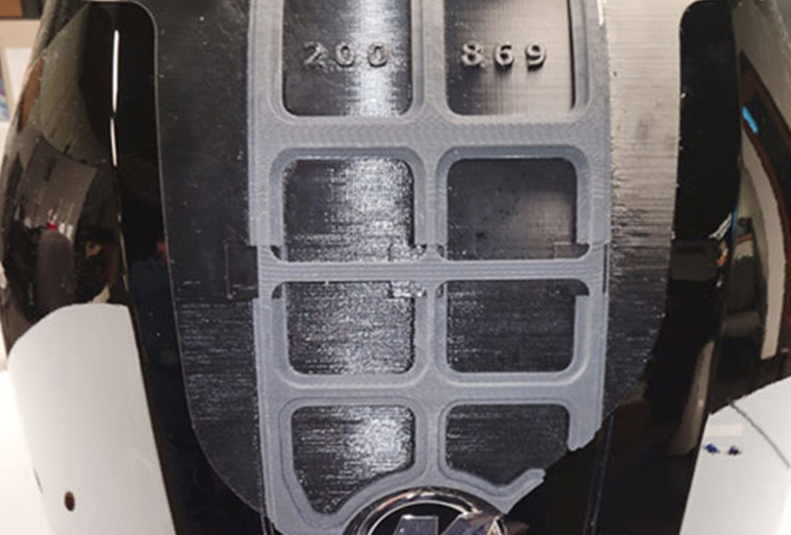 Fixture shown in place on the engine cowl.