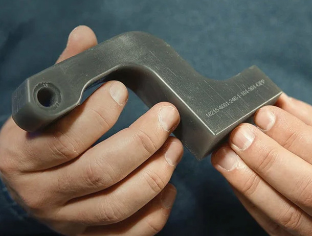 A main bracket Valiant TMS printed, shown with embossed 3D printing.