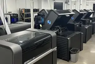 Scaling Additive Manufacturing: What Changes as Programs Grow 