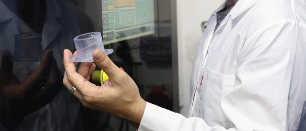 Doctor holding a 3D printed biocompatible medical part